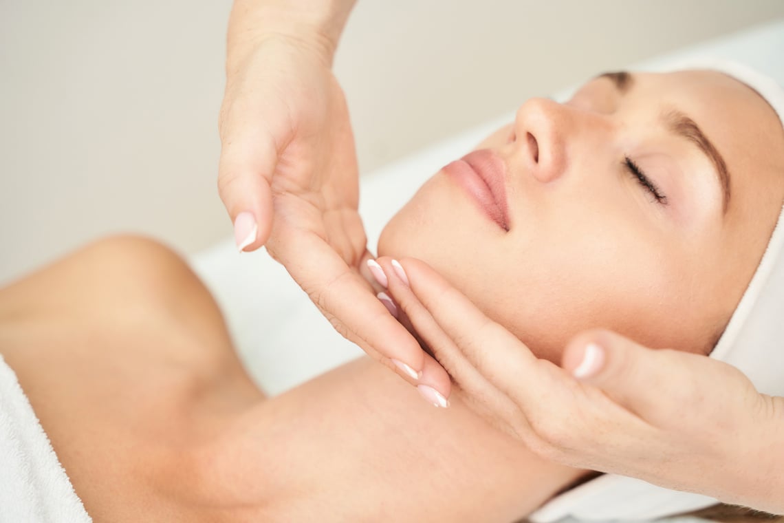 Woman Having Facial Massage Inside Spa