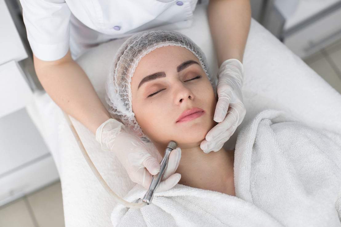 Woman Getting Facial Hydro Microdermabrasion Peeling Treatment at Cosmetic Beauty Spa Clinic.